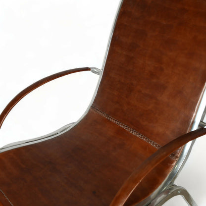 A PAIR OF MIDCENTURY LEATHER ARMCHAIRS